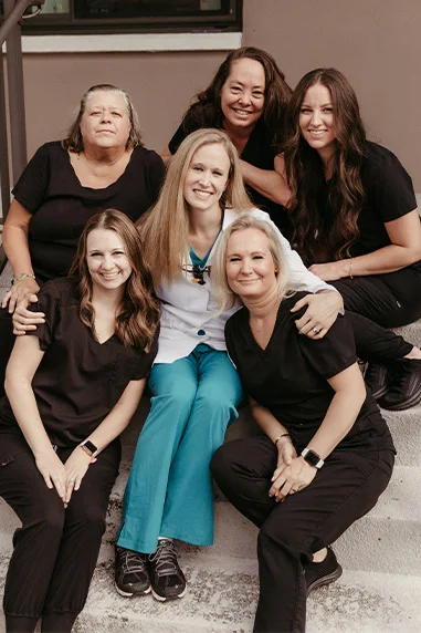 Pier Dental Staff smiling outside of Office